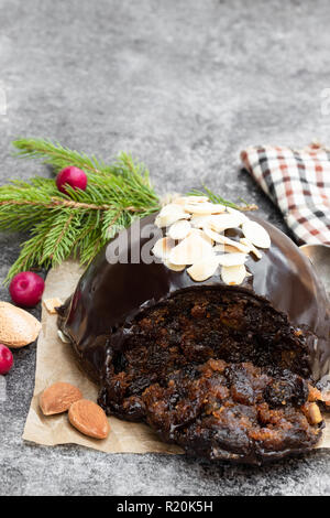 Homemade  Christmas pudding on gray stone background Stock Photo