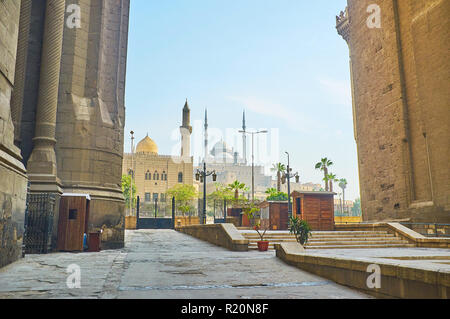 The view on the Al-Mahmoudia mosque and the  great Alabaster (Muhammad Ali) mosque of Saladin Citadel from the pass between the huge walls of Al-Rifai Stock Photo