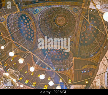 CAIRO, EGYPT - DECEMBER 21, 2017: The richly decorated complex dome of Alabaster (Muhammad Ali) Mosque of Saladin Citadel with semi-domes, carved and  Stock Photo