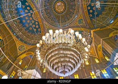 CAIRO, EGYPT - DECEMBER 21, 2017: The vintage glass chandelier in Alabaster (Muhammad Ali) Mosque of Saladin Citadel with a view on masterpiece dome o Stock Photo