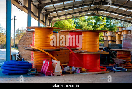 Wooden Coils cable duct for optical fibers Outdoor in a warehouse Stock Photo