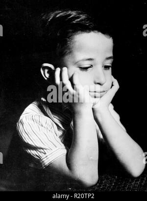 Photographic portrait of a pensive six year-old King Feisal of Iraq. Dated 1942 Stock Photo