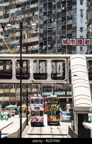 Hong Kong, China - May 16 2018: Tram and other traffic in the streets of North Point, a high density mostly working class residential district in Hong Stock Photo