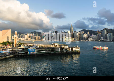 Hong Kong, China - May 15 2018: Aerial view of a Star Ferry  reaching his pier in Kowloon with Hong Kong island skyline. Stock Photo