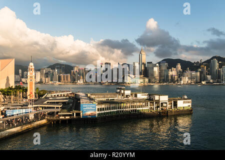 Hong Kong, China - May 15 2018: Aerial view of the Star Ferry terminal in Tsim Sha Tsui waterfront in Kowloon with Hong Kong island skyline. Stock Photo