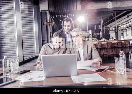 Positive delighted office workers having online conference Stock Photo