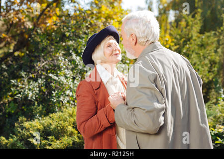 Positive nice man kissing his beloved wife Stock Photo