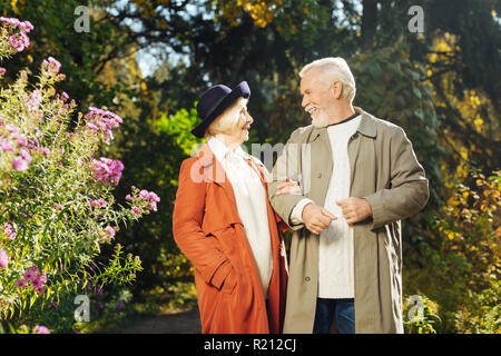 Happy elderly people talking to each other Stock Photo