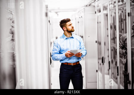 Technician using digital tablet Stock Photo