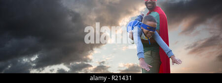 Composite image of father and son pretending to be superhero Stock Photo
