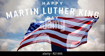 Composite image of rear view of sportsman posing with an american flag Stock Photo