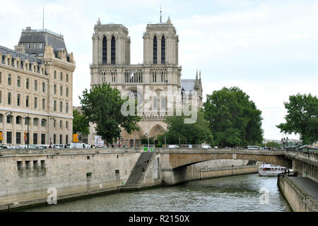 Paris, France, June 19: View of the River Seine from the embankment and the bridge, and the building of Notre Dame de Paris, against a blue sky June 1 Stock Photo