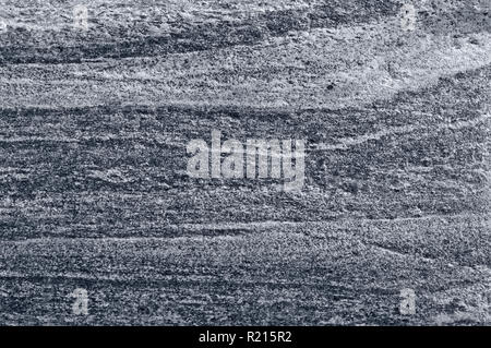 Migmatitic gneiss migmatite rock bands pattern, grey light dark banded granite texture macro closeup, large detailed textured silver gray horizontal Stock Photo