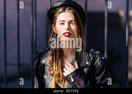 Beautiful dark-haired photo model posing while shooting for magazine Stock Photo