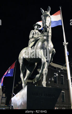 The equestrian statue of Queen Wilhelmina in Amsterdam is located on Rokin street, at the corner with Langebrugsteeg alley. The statue of Queen Wilhelmina of the Netherlands was sculpted in bronze by Theresia R. van der Pant. Stock Photo