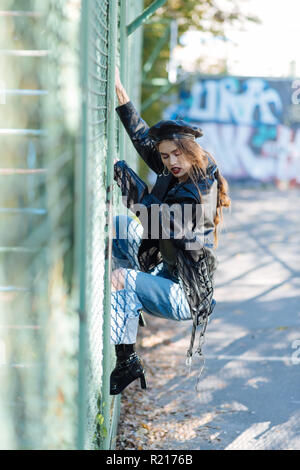 Fashion model wearing three hair slides and massive earrings Stock Photo
