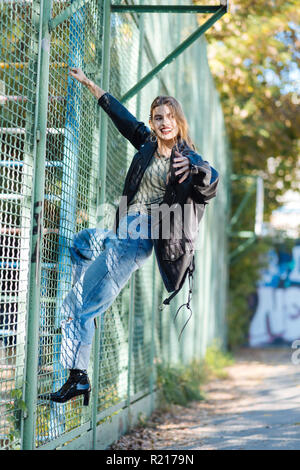 Appealing trendy fashion model wearing black leather beret Stock Photo