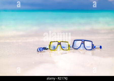 Snorkeling equipment mask and snorkel on tropical white sand beach Stock Photo