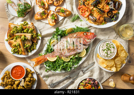Holiday Italian Feast of 7 Fishes with Snapper Octopus and Pasta Stock Photo