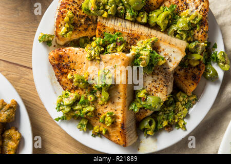 Homemade Grilled Swordfish Steaks with Olive Topping Stock Photo