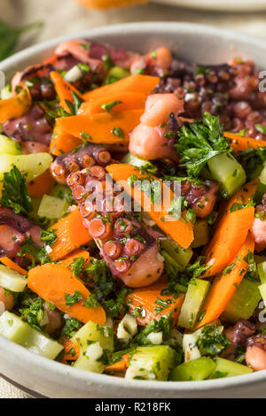 Homemade Mediterranean Octopus Salad with Vegetables and Dressing Stock Photo