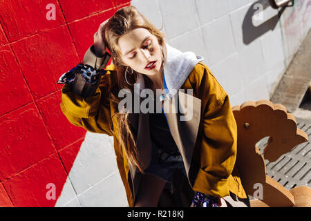 Dark-haired trendy skinny model posing for magazine cover Stock Photo