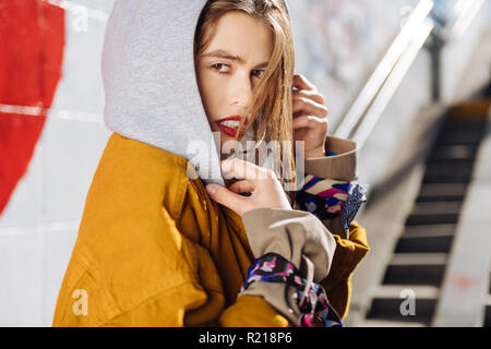 Dark-eyed young photo model with pleasant appearance working outside Stock Photo