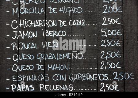 Restaurant menu in Spanish - outdoor tapas bar in Seville, Spain Stock Photo