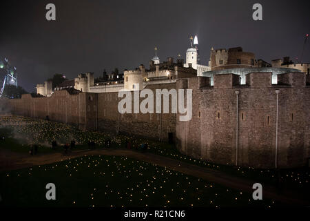 As commemoration of the centenary of the end of the First World War, an installation at the Tower of London, called Beyond the Deepening Shadow: The Tower Remembers fills the moat with thousands of individual flames: a public act of remembrance for those who lost their lives in the Great War, on 4th November 2018 in London, United Kingdom. The tribute will run for eight nights, leading up to and including Armistice Day. Stock Photo