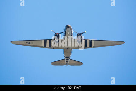 MONROE, NC (USA) - November 10, 2018: The underside of a C-47 cargo aircraft in flight at the Warbirds Over Monroe Air Show. Stock Photo