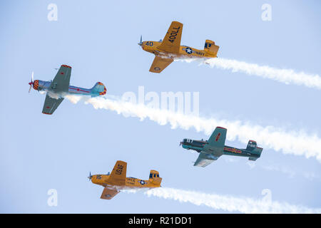MONROE, NC (USA) - November 10, 2018: Four aerobatic aircraft flying in formation at the Warbirds Over Monroe Air Show. Stock Photo