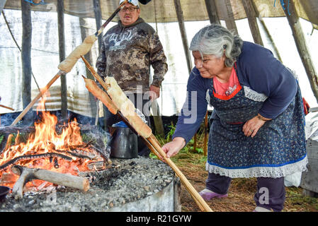 Cree people cooking wild geese in a teepee in Northern Quebec Stock Photo