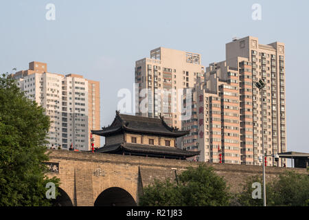 Apartments above the city wall in Xian, China on smoggy day Stock Photo