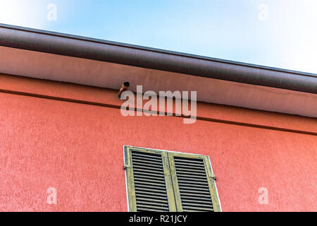 rusty Gutter pipe in old house Stock Photo