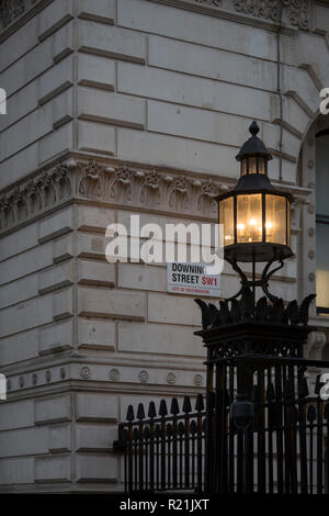 As Prime Minister Theresa May negotiates Brexit issues and members of her own Conservative government continue to resign in response to her presentation of the current terms, the light on Downing Street's reinforced security railings shines onto the walls of Whitehall, on 15th November 2018, in London, England. Stock Photo