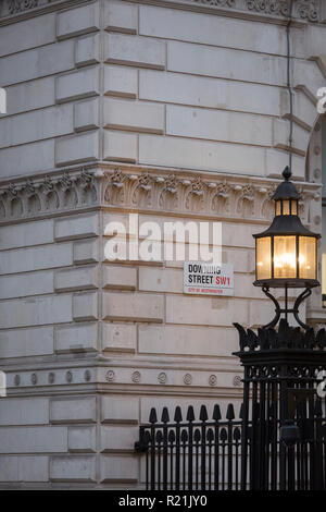 As Prime Minister Theresa May negotiates Brexit issues and members of her own Conservative government continue to resign in response to her presentation of the current terms, the light on Downing Street's reinforced security railings shines onto the walls of Whitehall, on 15th November 2018, in London, England. Stock Photo