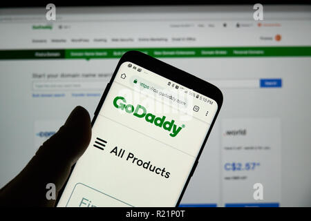 MONTREAL, CANADA - OCTOBER 3, 2018 : GoDaddy page, logo and app on a S8 Samsung cell phone. GoDaddy is an American publicly traded Internet domain reg Stock Photo