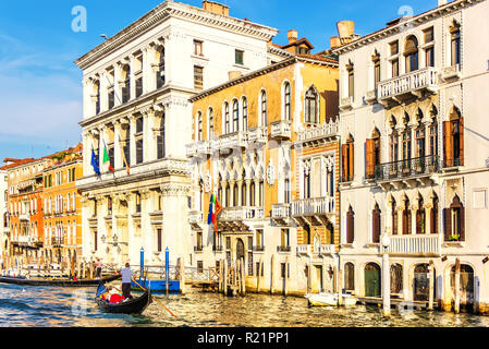 Beautiful venetian palaces and a gondolier in Grand Canal Stock Photo