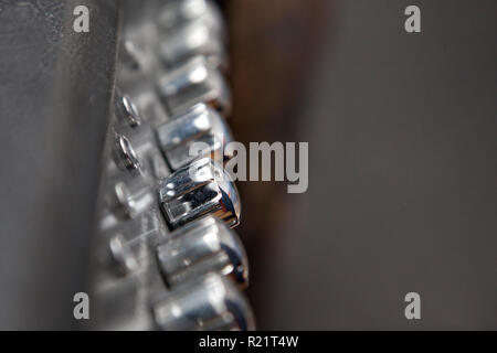 Silver knobs that adjust sound and control on a music amplifier Stock Photo