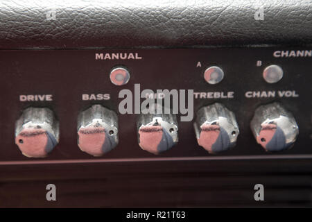 Dials that set the range and channel for a guitar amplifier Stock Photo