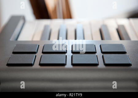 A digital piano keyboard with midi pads for creating sounds Stock Photo