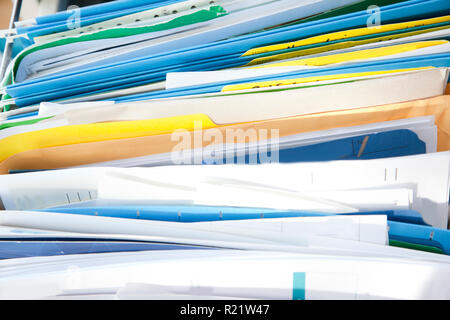 A messy drawer or cabinet with filed papers and documents sorted in folders Stock Photo