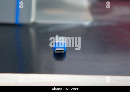 A blue memory stick or usb flash drive with copy space on a desk Stock Photo