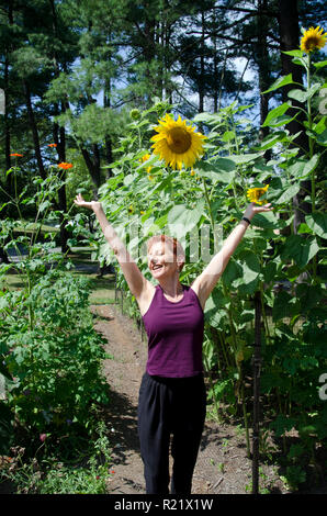 Joy with sunflowers, Omega Institute, NY Stock Photo