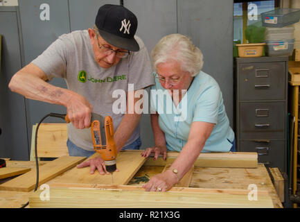 Older couple working on building wood planter project together, Aging in place, Yarmouth, ME Stock Photo