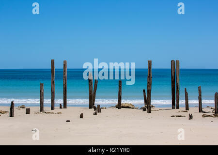 The beautiful Port Willunga beach and iconic jetty ruins with turquoise waters on a calm sunny day on 15th November 2018 Stock Photo