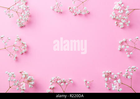 Frame of white flowers, gypsophila, Baby's Breath. Flat lay composition. Romantic concept. Top view. Copy space. Stock Photo