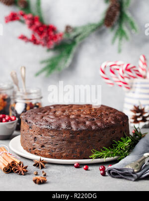 Christmas fruit cake, pudding on white plate. Copy space. Stock Photo