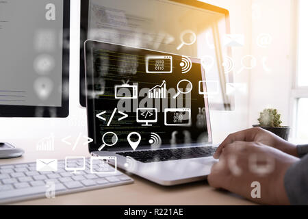 man work Coding software developer programmer is coding on a desktop computer Stock Photo