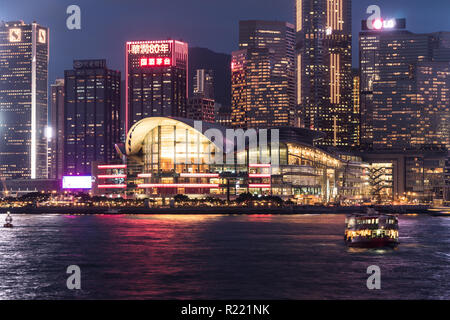 Hong Kong, China - May 17 2018: Star ferry crossing the Victoria harbour with the Hong Kong island skyline in the background with the Hong Kong Conven Stock Photo